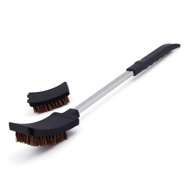 Two grill brushes with black handles and brown bristles on a white background