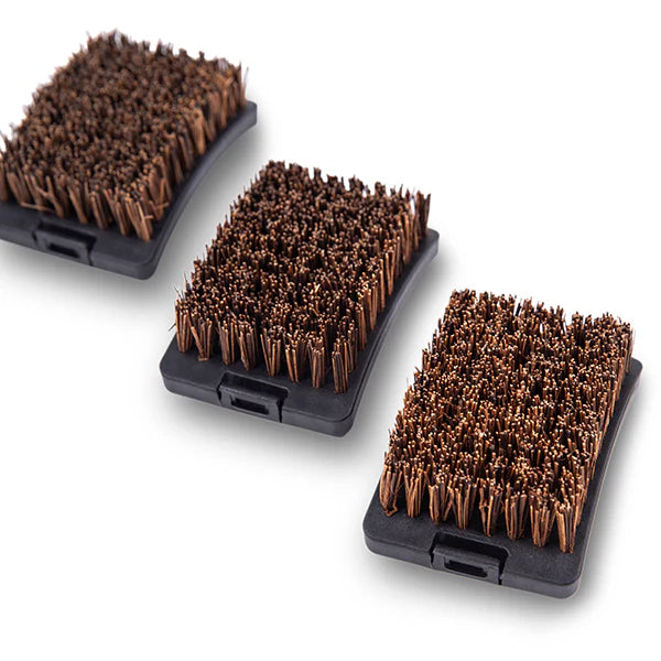 Three rectangular brushes with brown bristles on black plastic bases against a white background
