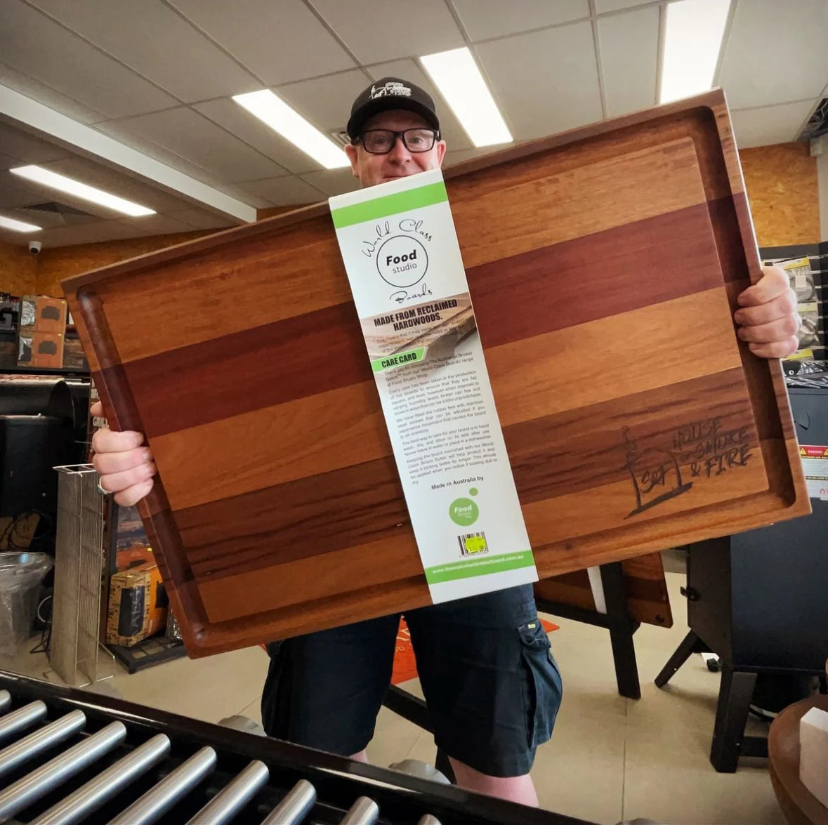 Large Brisket Board Being Held Up