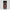 Jar of brisket rub with a red and black label on a white background